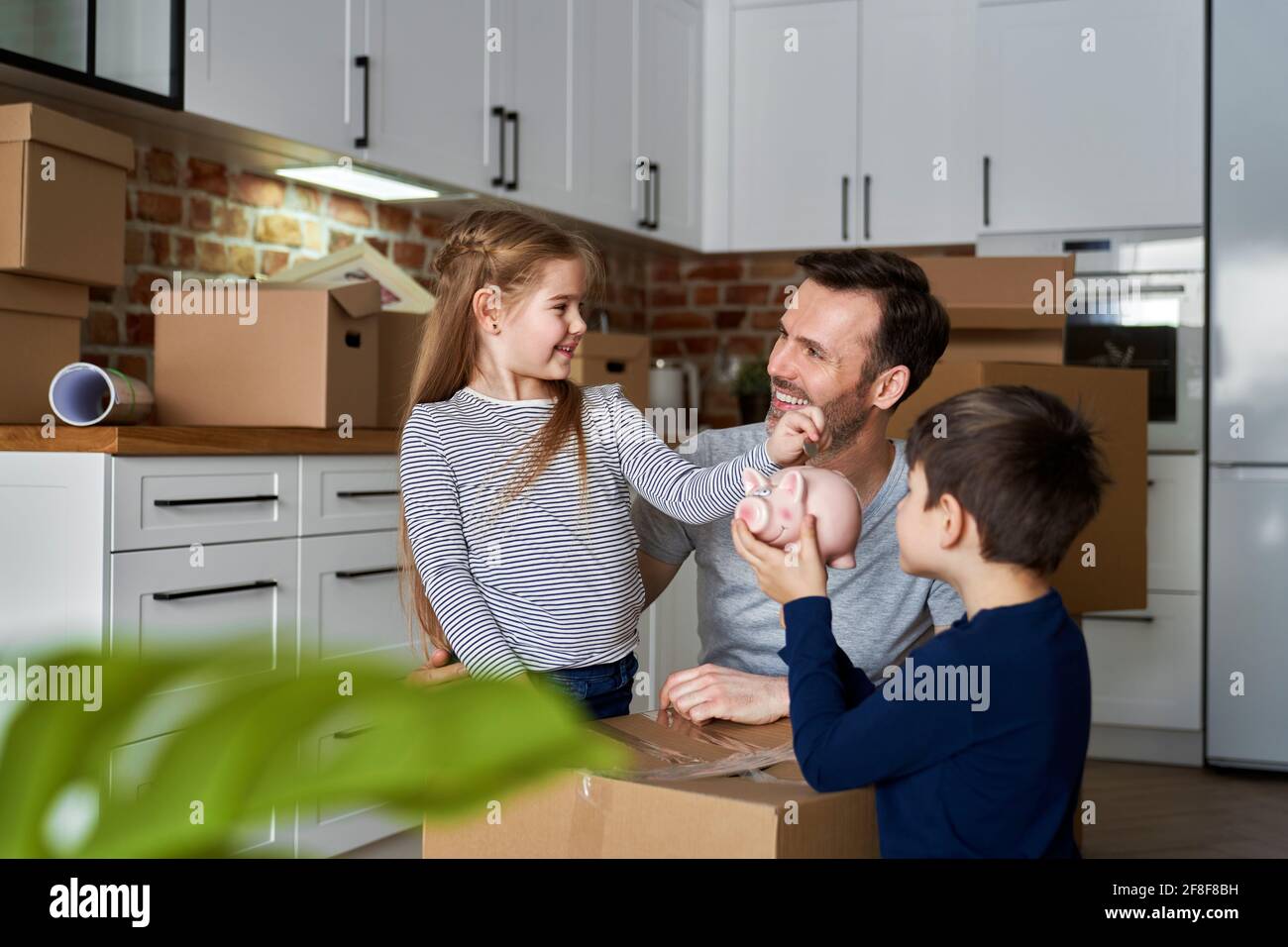 Happy father with children savings money Stock Photo