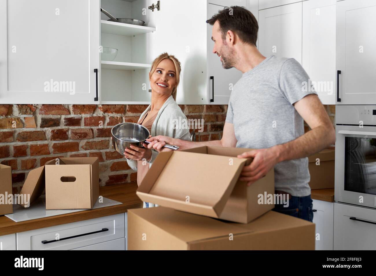 Happy couple during moving house Stock Photo