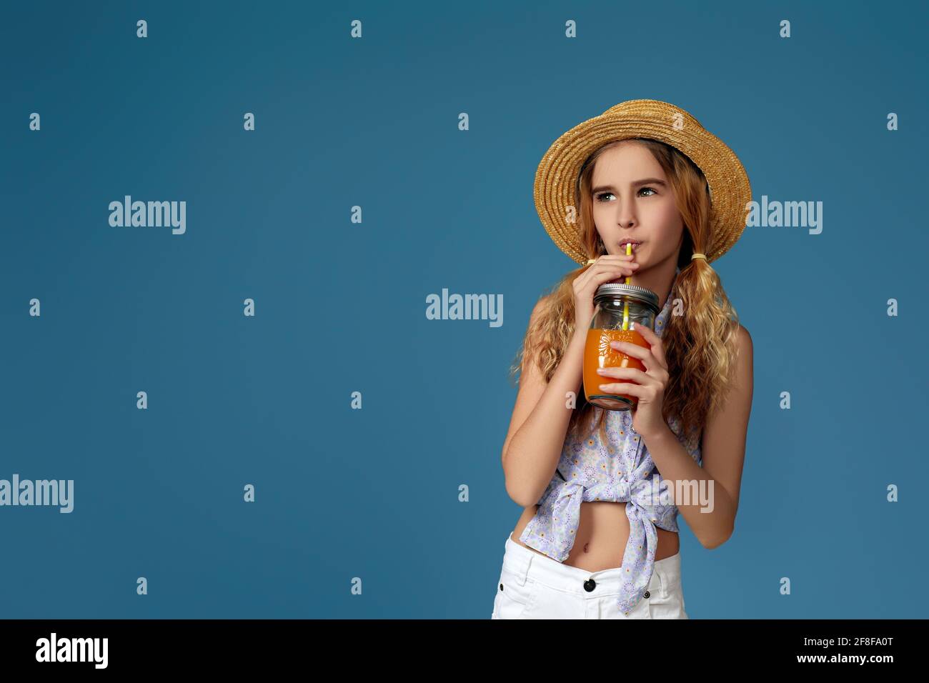 Portrait of cute little child girl drinking orange juice Stock Photo ...
