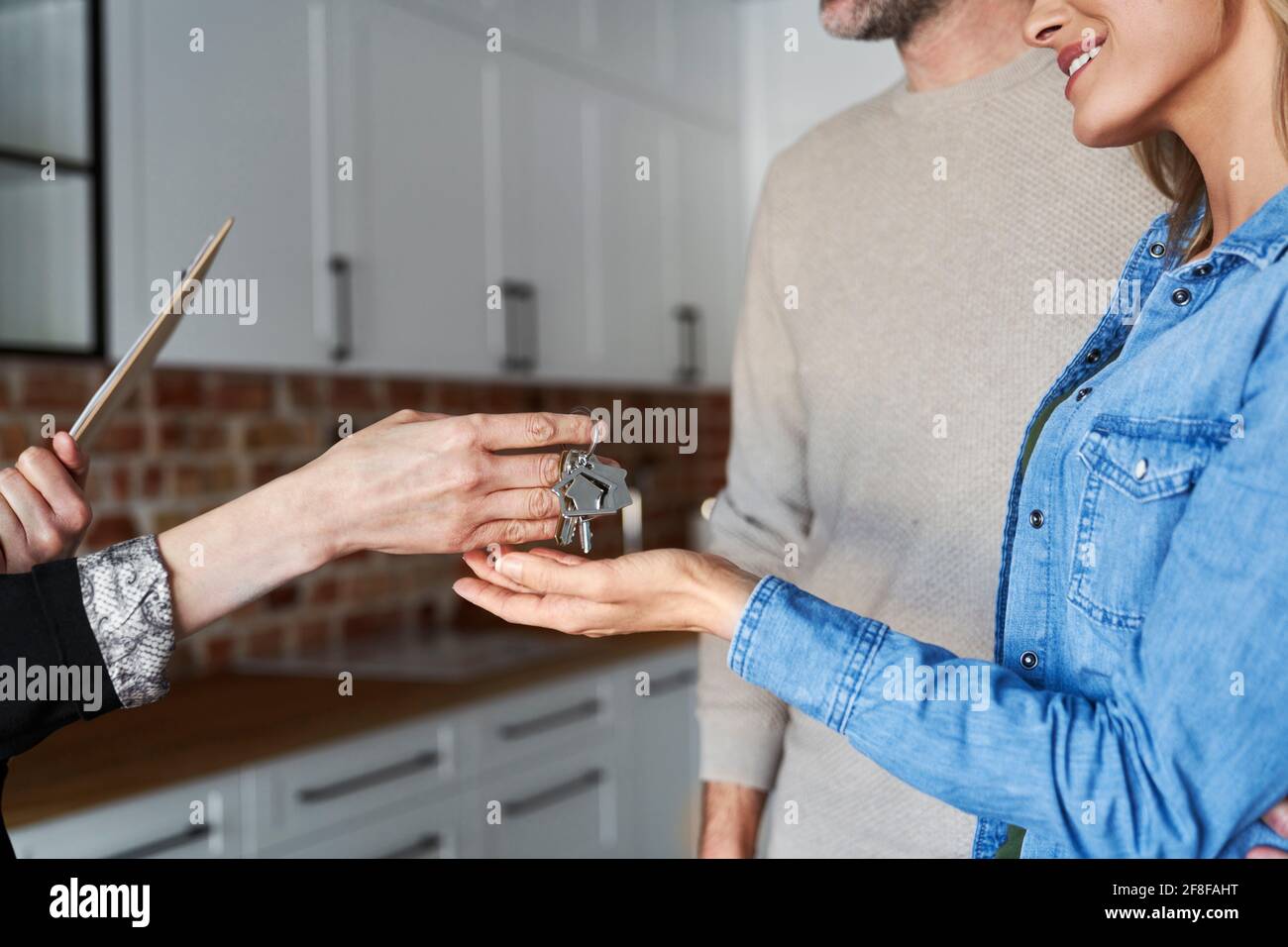 Woman gives the keys to the clients Stock Photo