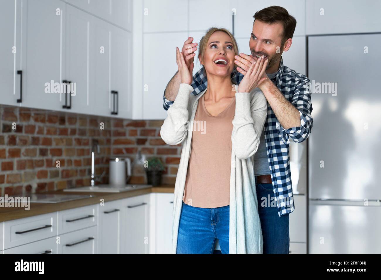 Woman surprised by a new apartment Stock Photo