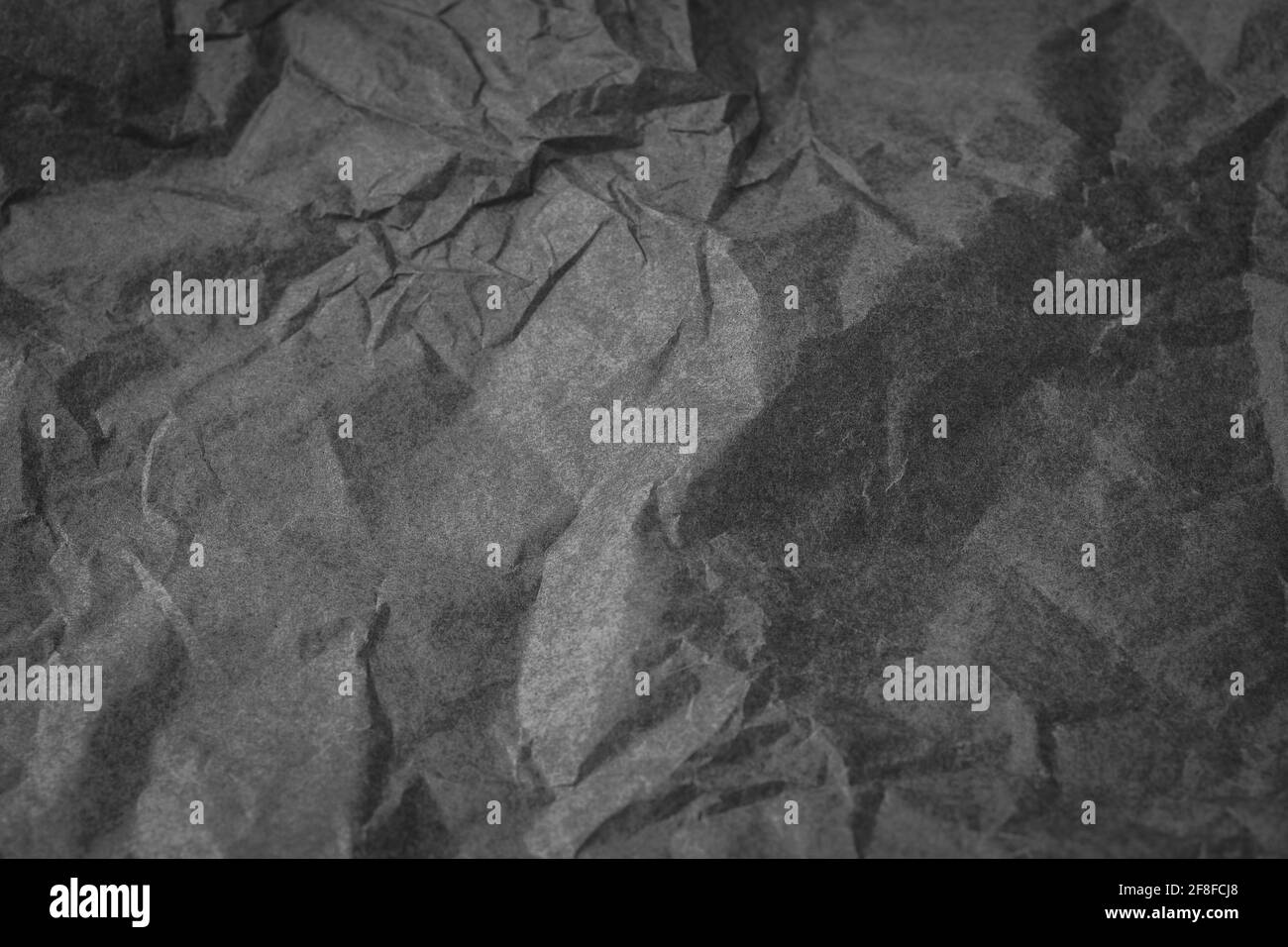 Black color creased paper tissue background texture, wrinkled tissue paper texture Stock Photo