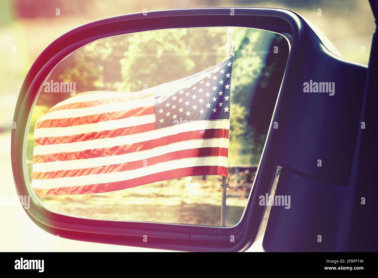 American flag in the car mirror Stock Photo Alamy