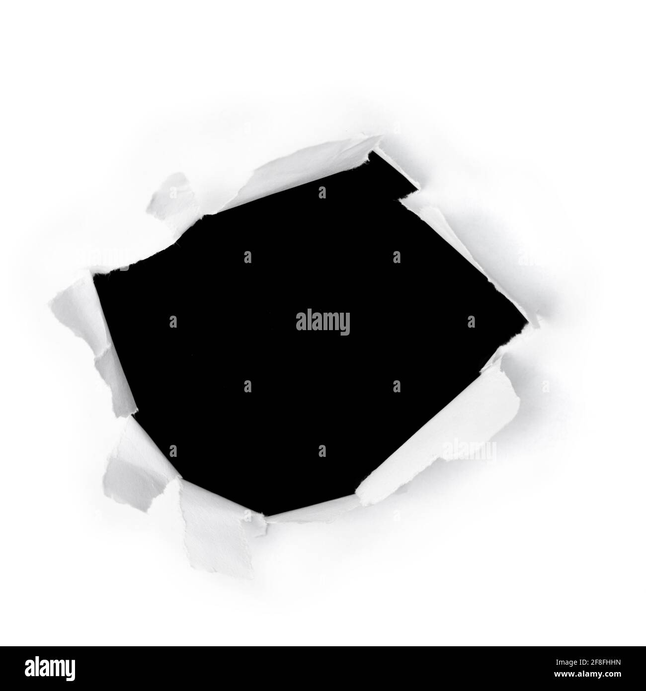 Hole with ripped edges in white paper with black background Stock Photo ...