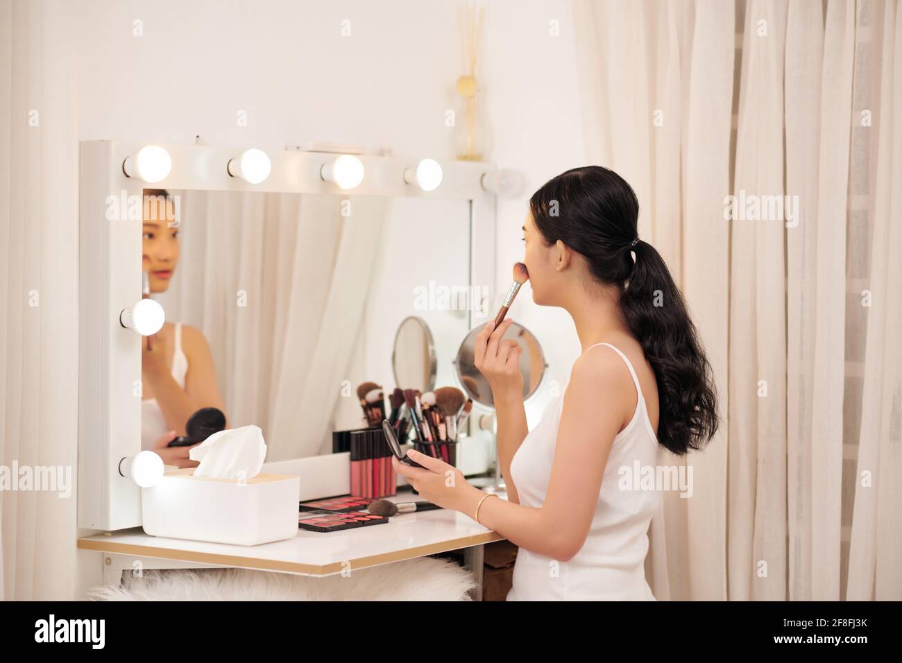 Woman curly hair mirror hi-res stock photography and images - Alamy