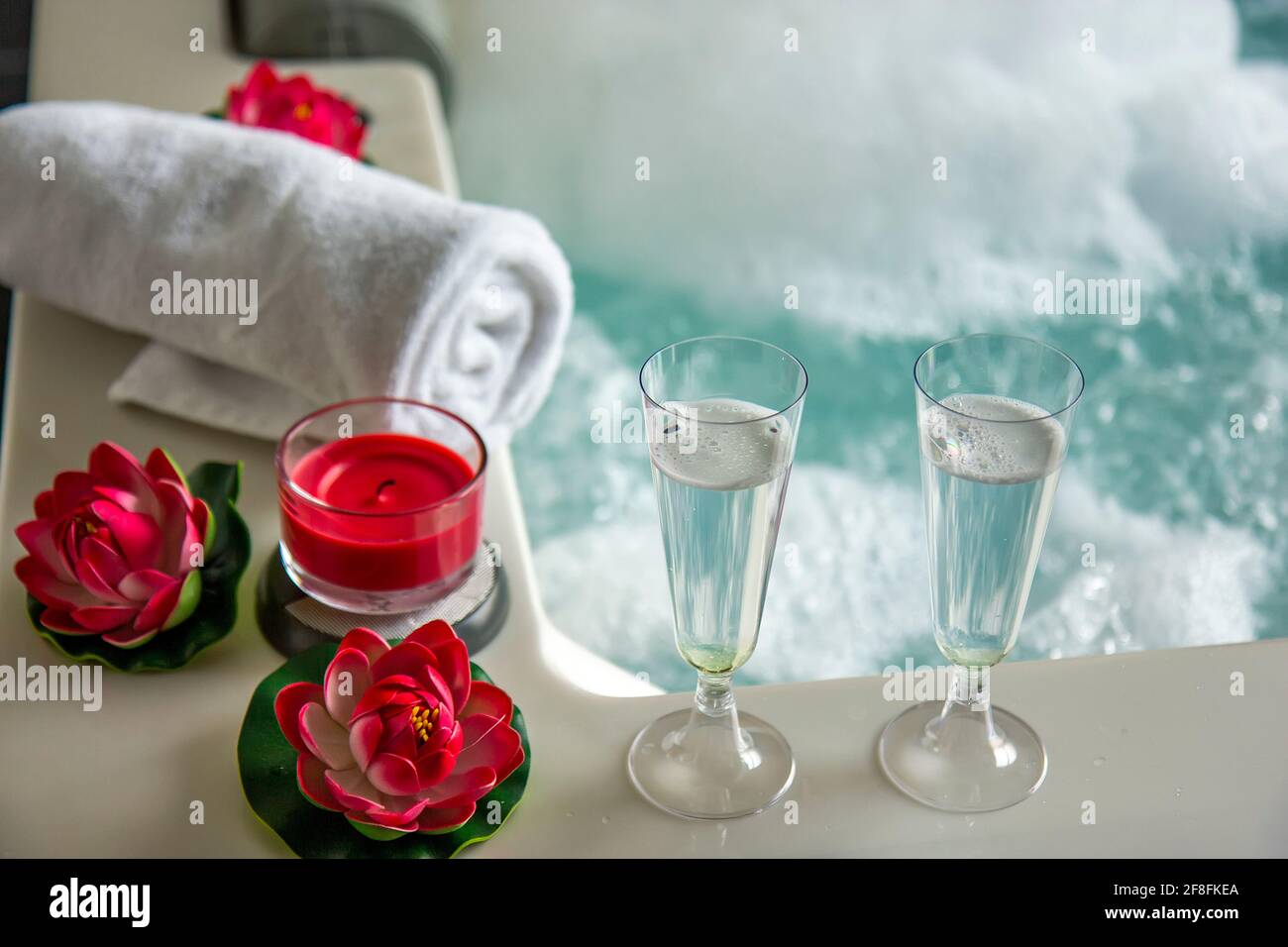 Champagne glasses on the hot tub Stock Photo Alamy