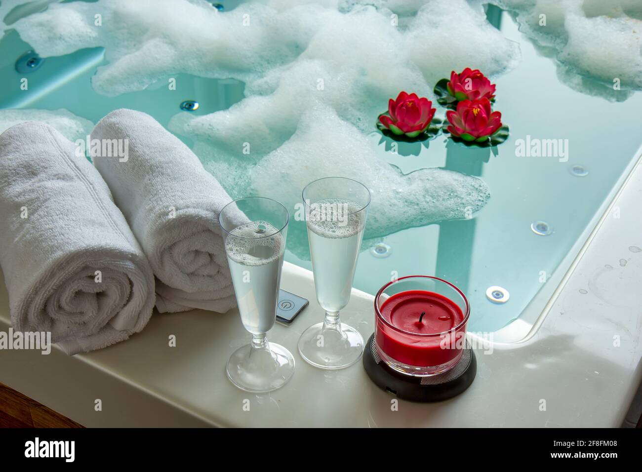 Champagne glasses on the hot tub Stock Photo Alamy