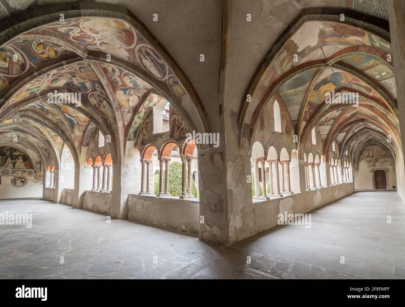 Cloister with fresco paintings of the Cathedral Duomo Santa Maria Assunta (German: Dom Mariae Aufnahme in den Himmel und St. Kassian) of Bressanone - Stock Photo