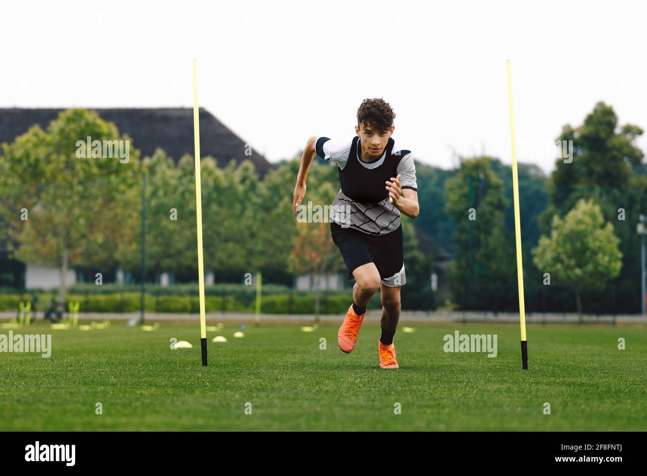Teenage Athlete on Running Training Speed Tests. Young Boy Running Fast