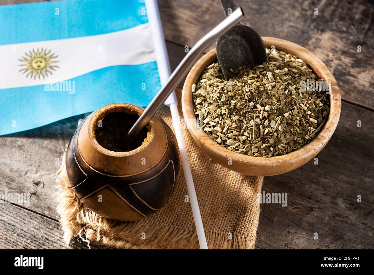 Yerba mate tea and Argentina flag on wooden table. Traditional Argentinian  beverage Stock Photo - Alamy