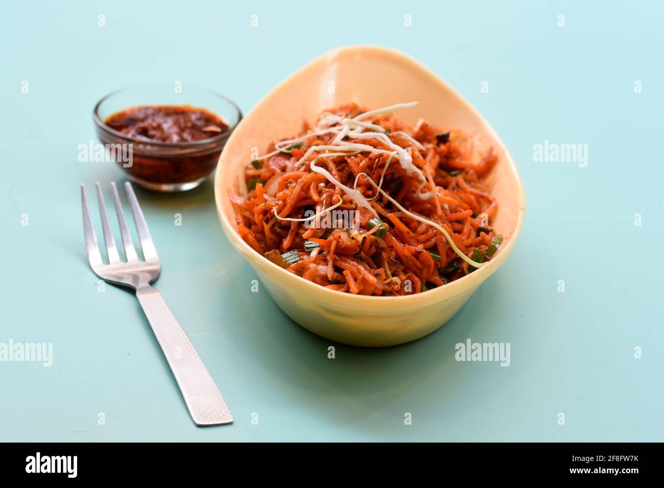 Schezwan Noodles or Manchurian Hakka or vegetable Hakka Noodles or chow mein indochinese food served in a bowl Indian Chinese food, Stock Photo