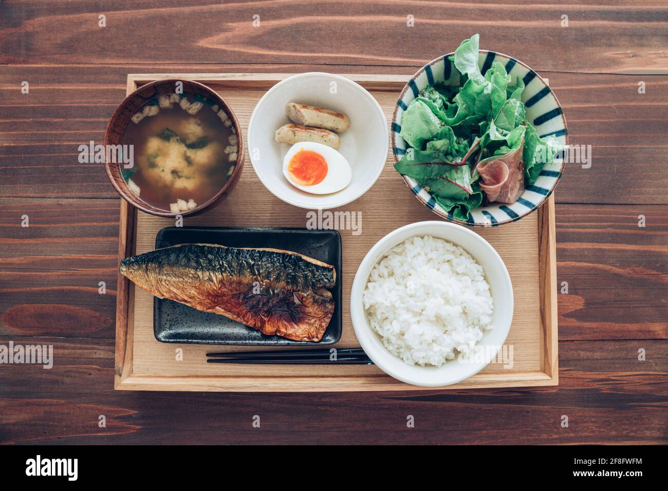 Japanese set lunch, grilled mackerel fish with miso soup and salad Stock Photo