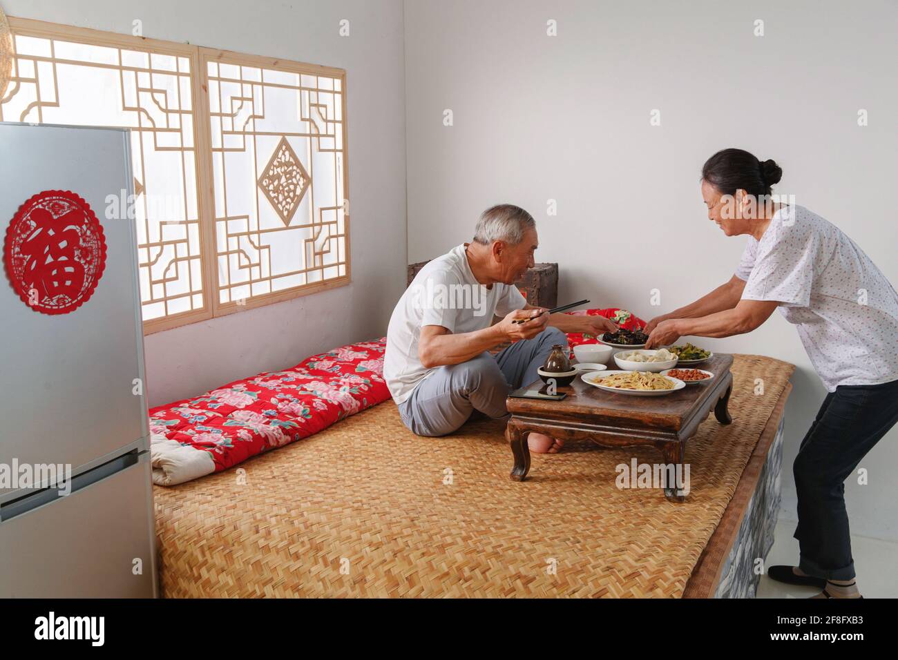Elderly couple at home for dinner Stock Photo Alamy