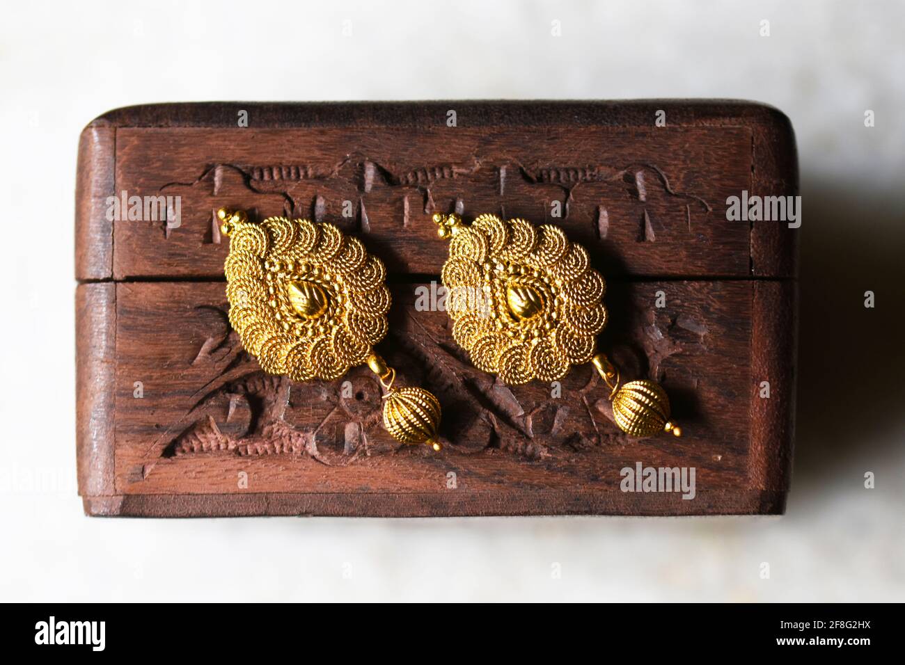 Beautiful Golden pair of earrings, Indian traditional jewellery, indian jewellery Bridal Gold earrings wedding jewellery Stock Photo