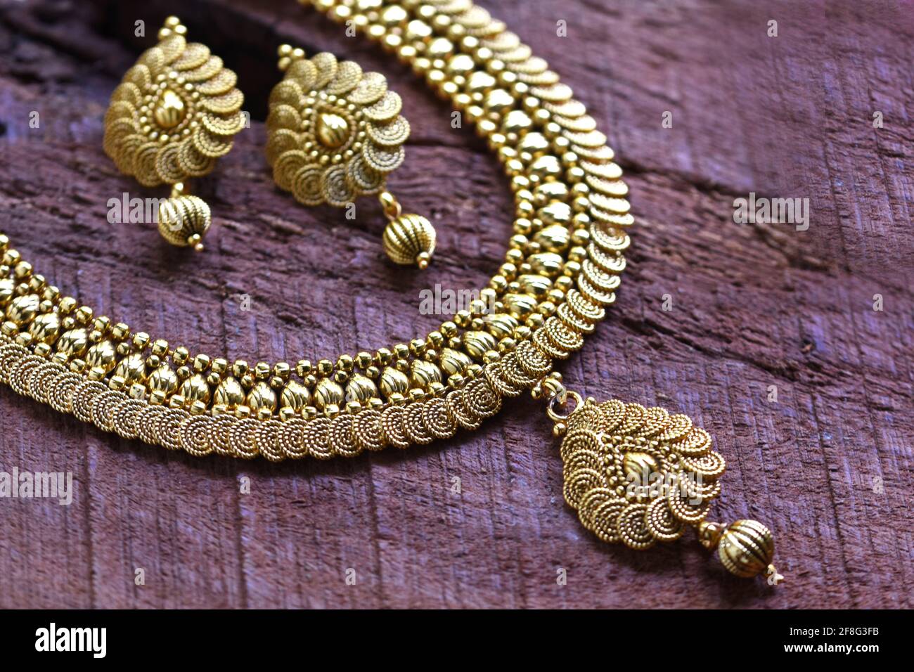 Beautiful Golden pair of earrings, Indian traditional jewellery, indian jewellery Bridal Gold earrings wedding jewellery Stock Photo