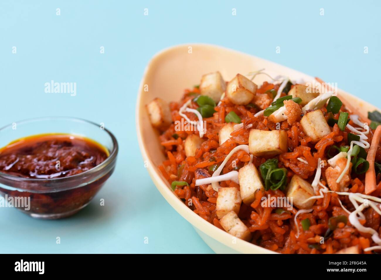 Schezwan paneer fried rice with schezwan sauce, Chinese fried rice with paneer, indo-chinese cuisine dishes Stock Photo