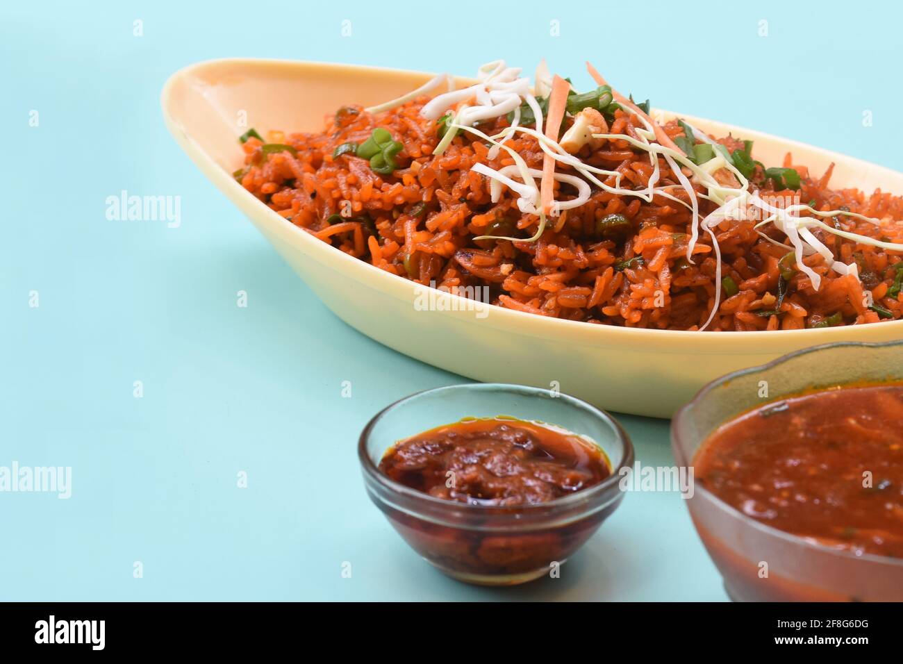 Schezwan fried rice with schezwan sauce, Chinese fried rice, garnished