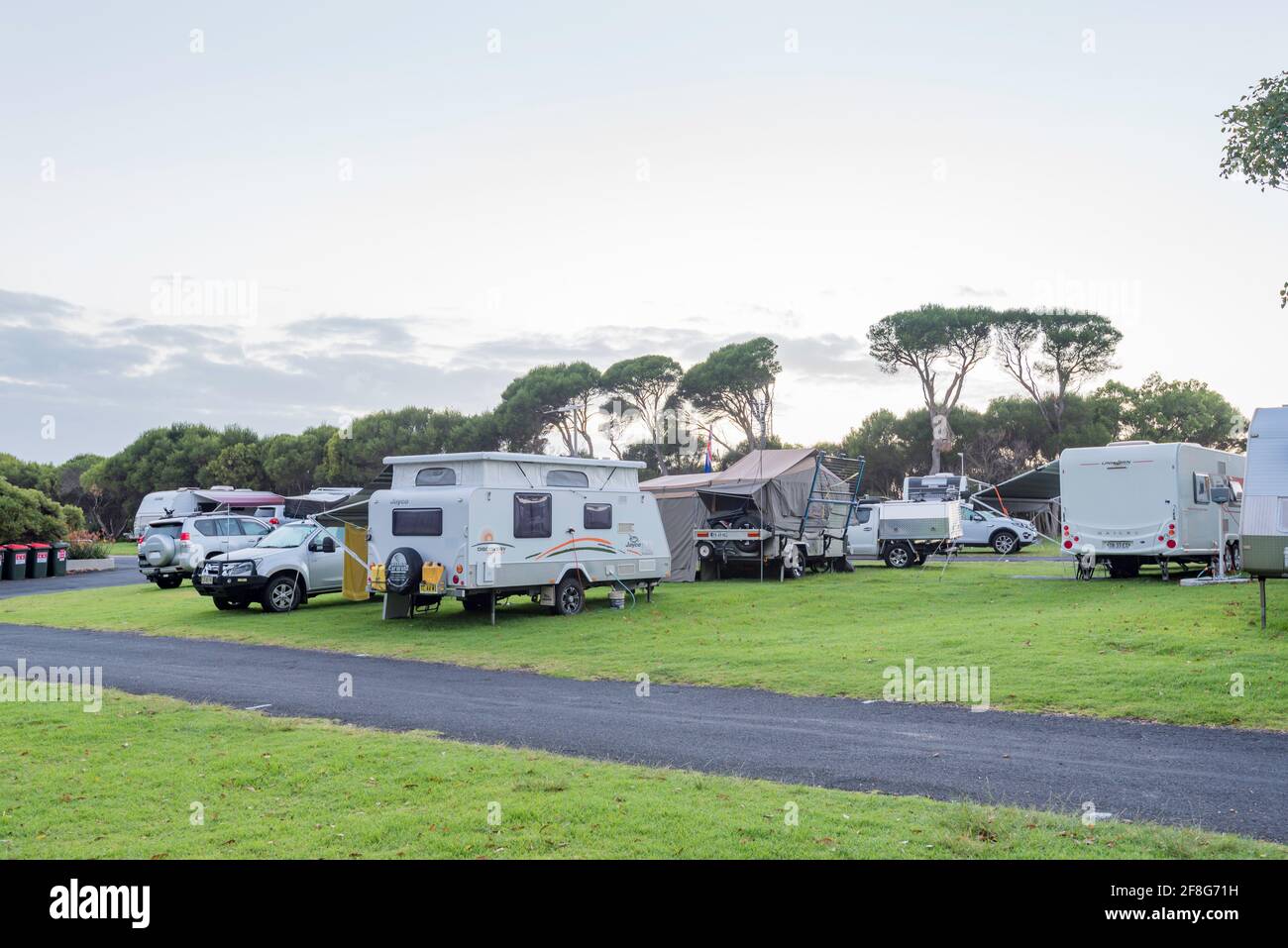 Caravans and a camper trailer in the early morning at Merimbula NRMA Caravan Park on the New
