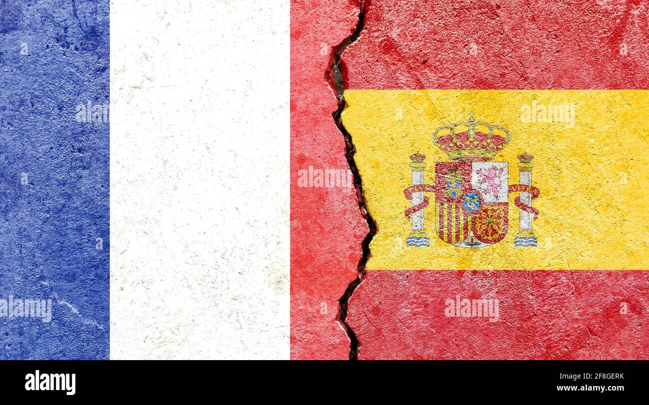 Grunge backdrop with France and Spain flags on a cracked wall Stock ...