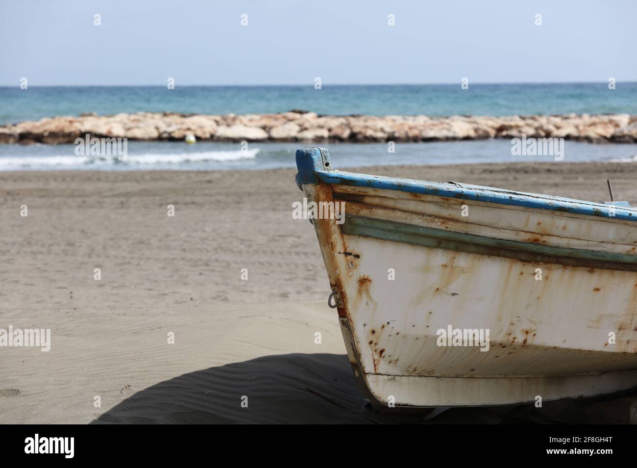 old fishing boat stranded on the sand Stock Photo - Alamy