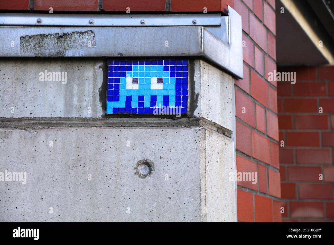DUISBURG, GERMANY - SEPTEMBER 18, 2020: Space Invaders pixel art mosaic in Duisburg city, Germany. 1970s and 1980s video game pixel art is a popular t Stock Photo