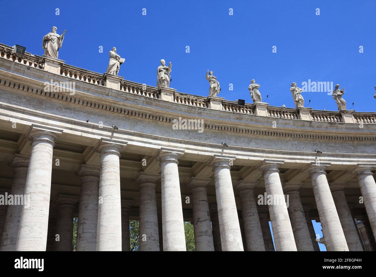 Vatican City landmark. Saint statues in the colonnade of  Saint Peter's Square (Piazza San Pietro) of Vatican. Stock Photo