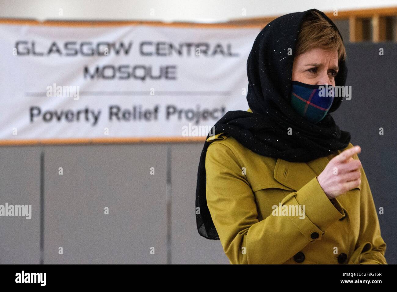 first-minister-and-leader-of-the-scottish-national-party-snp-nicola-sturgeon-wearing-a-face-covering-and-a-head-scarf-during-her-visit-to-glasgow-central-mosque-during-campaigning-for-the-scottish-parliamentary-election-picture-date-wednesday-april-14-2021-2F8GT6R.jpg