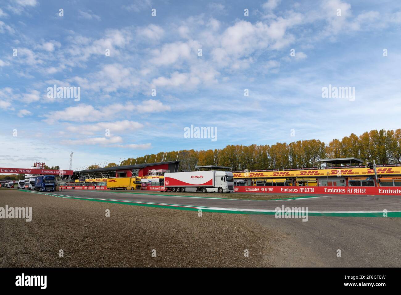 Imola, Emilia Romagna, Italy:Enzo and Dino Ferrari racetrack before 2020 Formula One (F1) world championship. View with trucks. racing brands and logo Stock Photo
