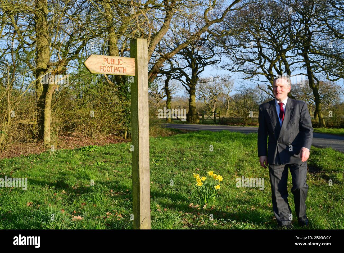 businessman walking in the countryside at springtime near york yorkshire united kingdom Stock Photo