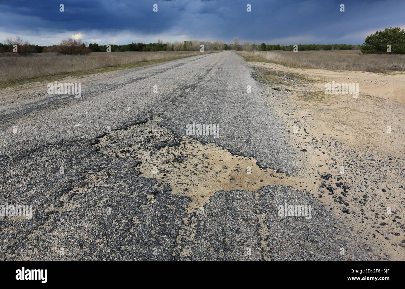potholes on an old asphalt country road Stock Photo Alamy