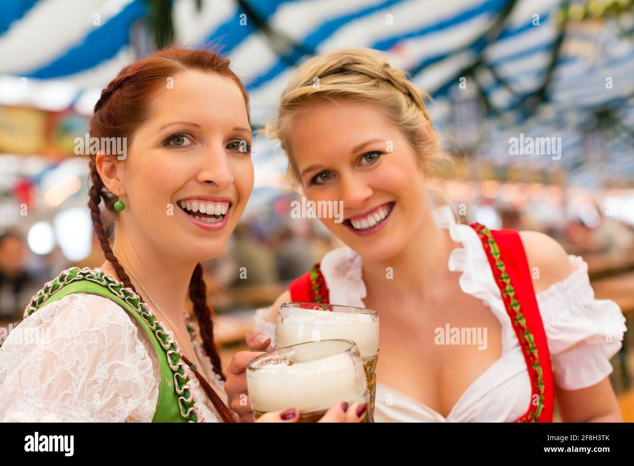 Young women in traditional Bavarian clothes - dirndl or tracht - on a ...