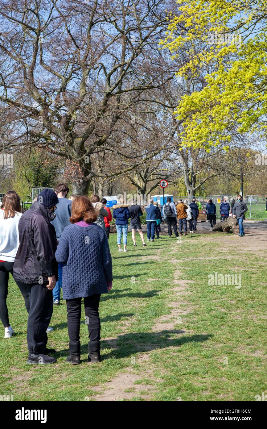 People Queue for Surge Testing Coronavirus on Clapham Common, London Uk - 14 April 2021 Stock Photo