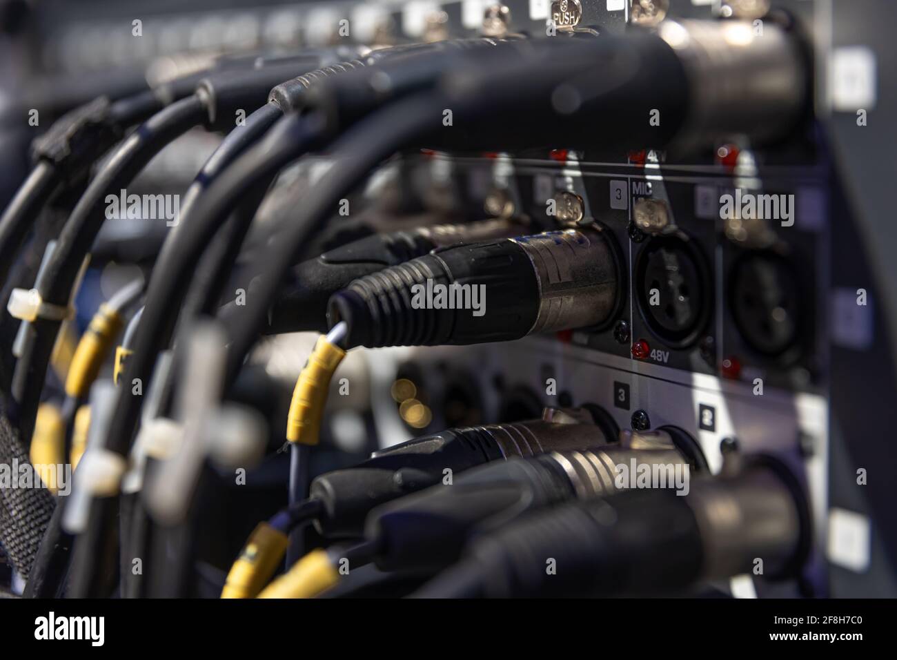 Audio snake and stage box with xlr cables and jacks at a live show