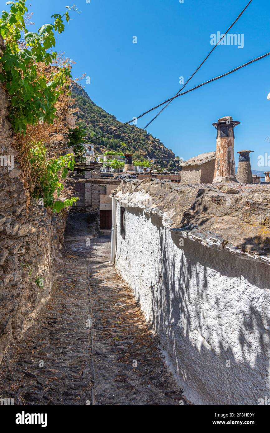 Typical white street of Pampaneira village in Spain Stock Photo