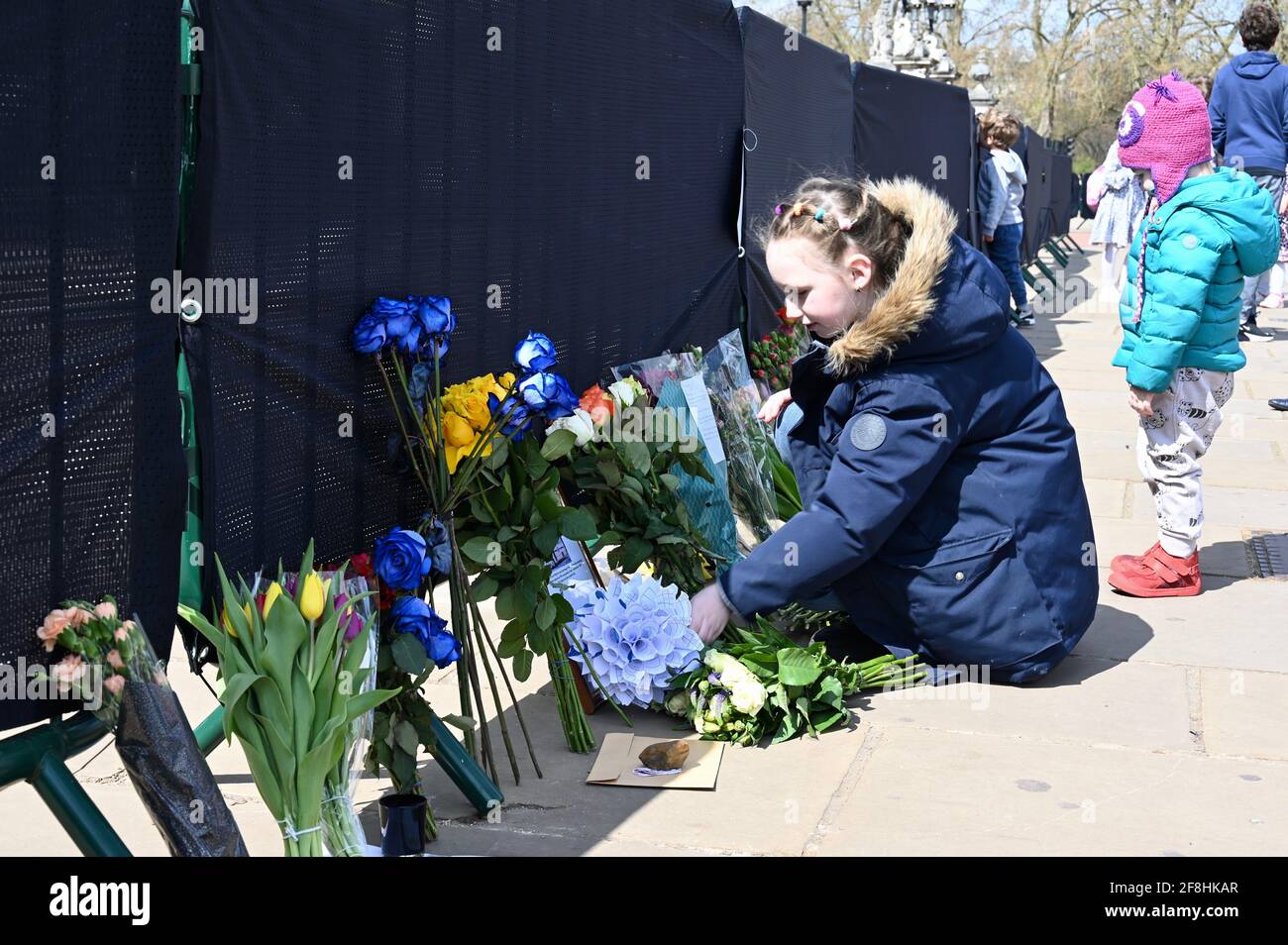 London.UK. Royal well wishers leave floral tributes to the Duke of Edinburgh following his death on Friday 09.04.2021. Mourners have been asked to stay away from Royal residences because of the Coronavirus Pandemic. Buckingham Palace, London. Stock Photo