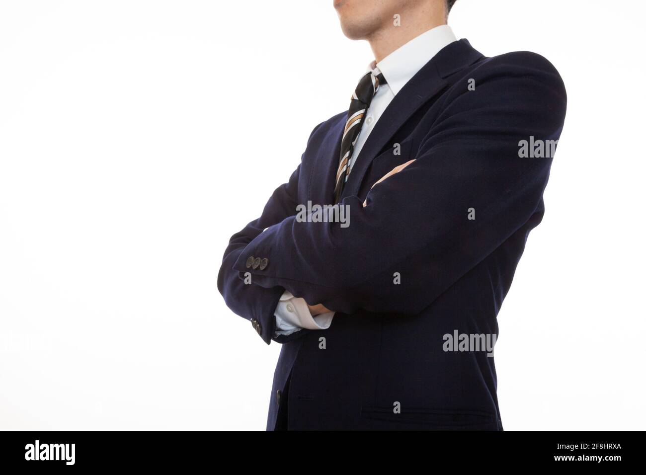 A dignified business person with arms folded Stock Photo