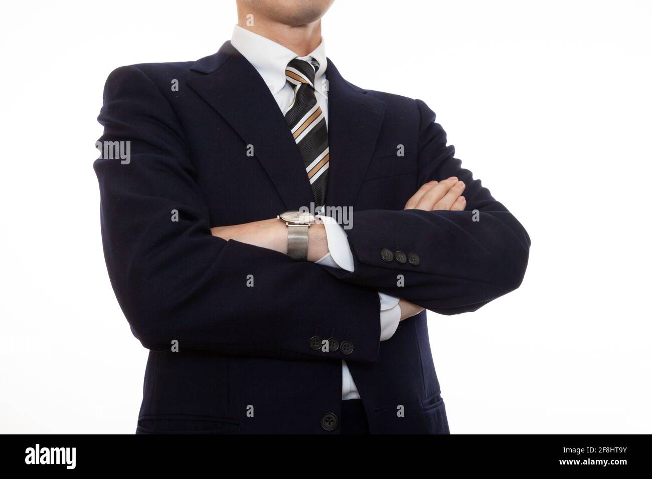 A dignified business person with arms folded Stock Photo