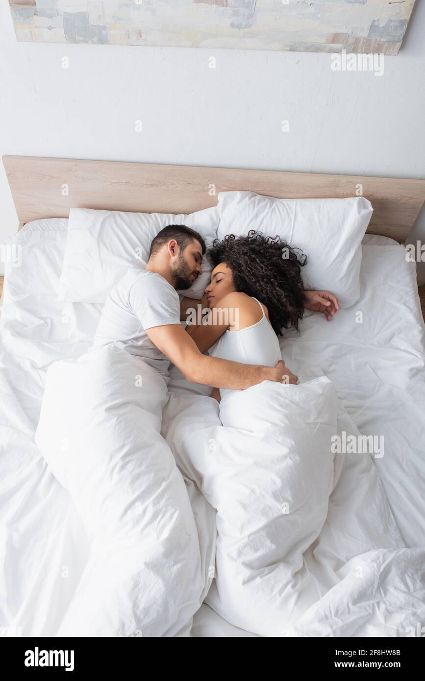 Couple sleeping in bed top view hi-res stock photography and images - Alamy