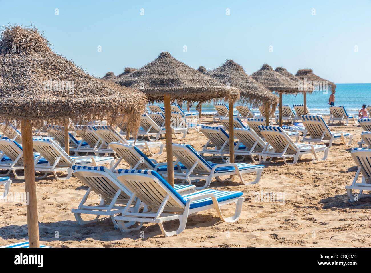 Sunbeds and umbrellas on a beach in Valencia, Spain Stock Photo