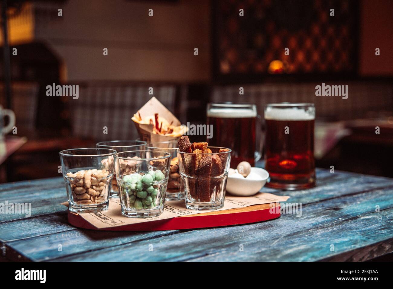 snacks to beer in glass glasses and two beers. Stock Photo