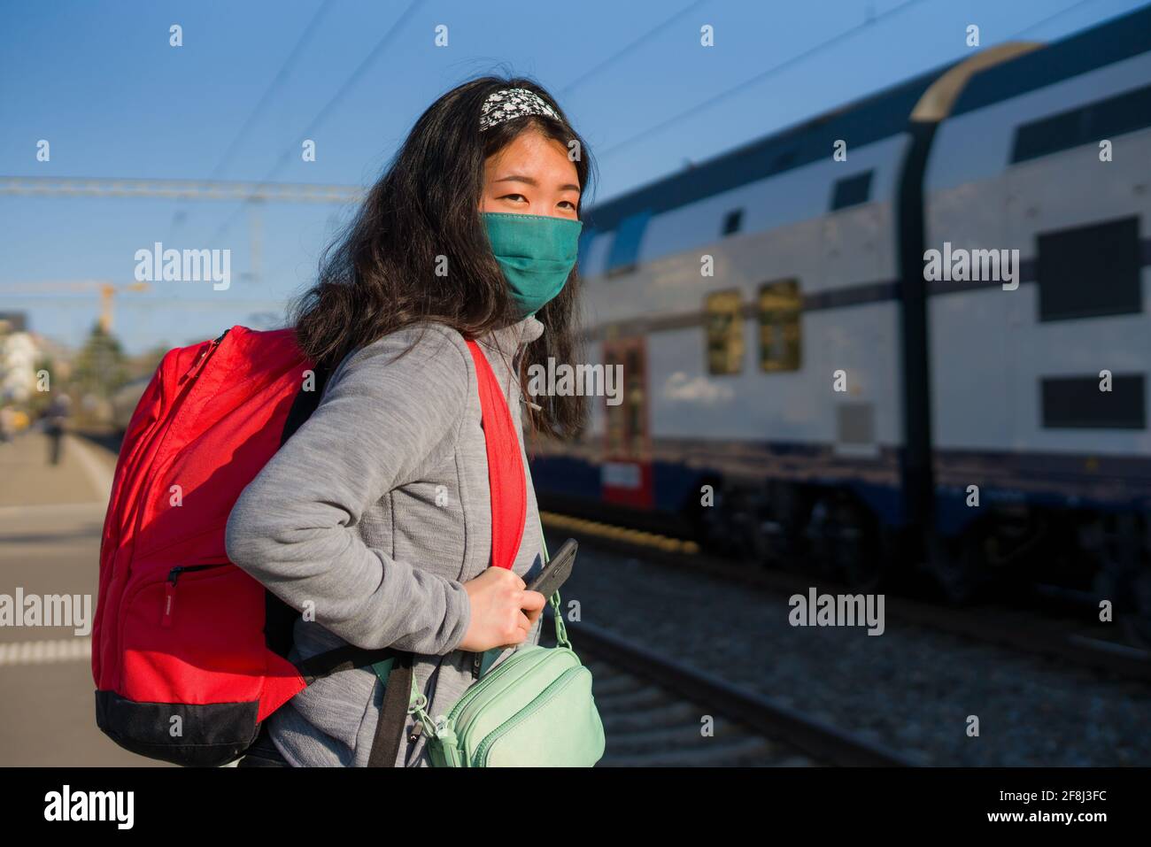 Asian backpacker girl traveling in times of covid19 - young happy and ...