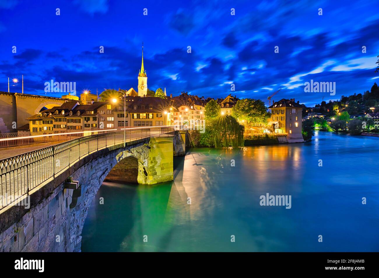 Scenic view of Untertorbrucke bridge in Bern old town with view of Nydeggkirche church. Capital of Switzerland, historic center. Urban cityscape at Stock Photo