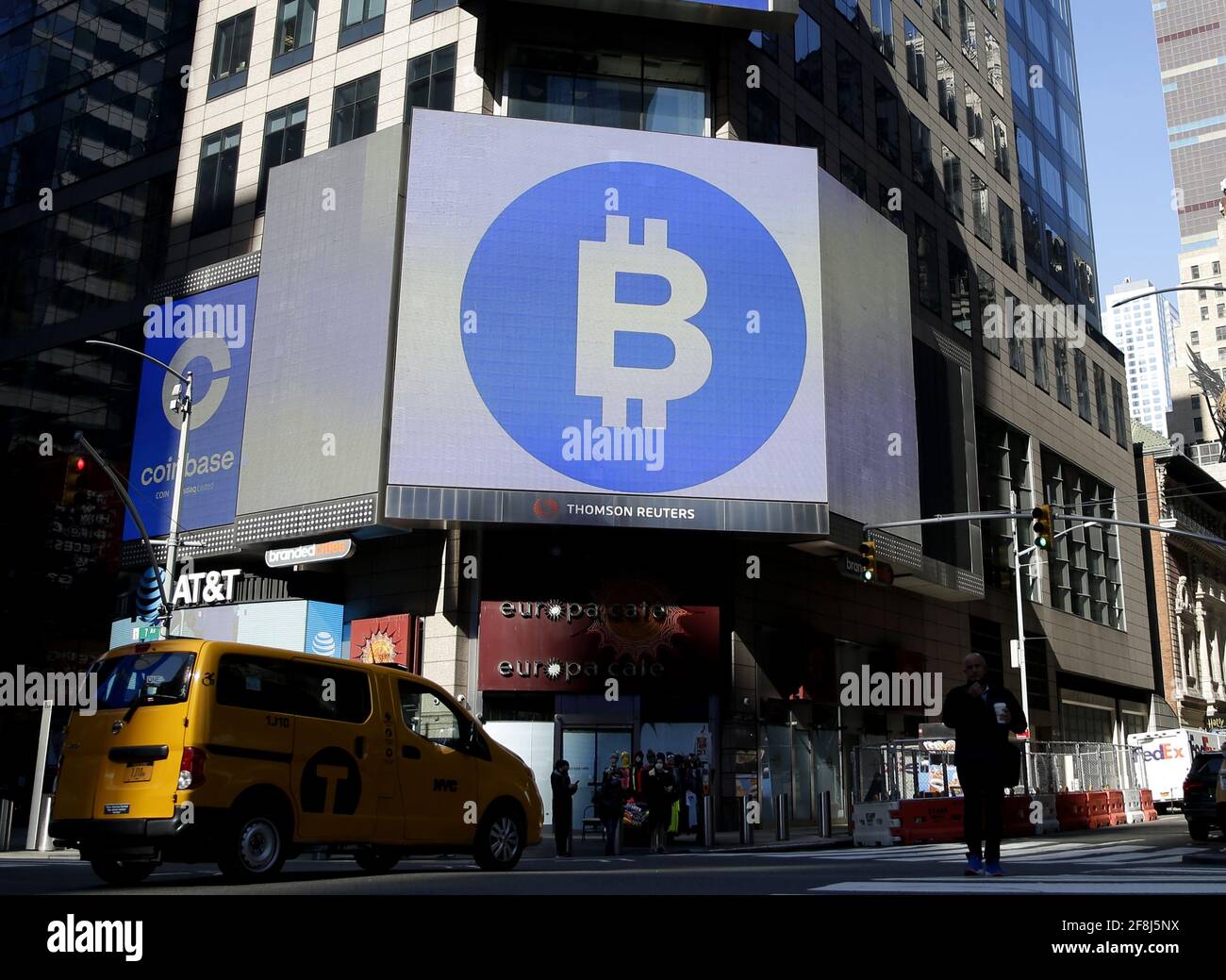 New York, United States. 14th Apr, 2021. The Bitcoin logo is displayed on a  screen in Times Square when Coinbase Global, Inc. beings trading under the  symbol COIN at the Nasdaq Opening