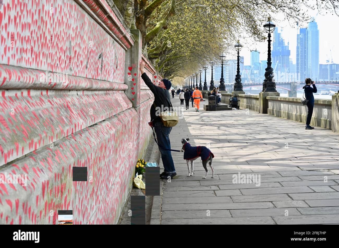 London. UK. 14th April 2021, The public continue to flock to the COVID memorial wall for the victims of the coronavirus who have passed away in the last year. St Thomas' Hospital, London Stock Photo