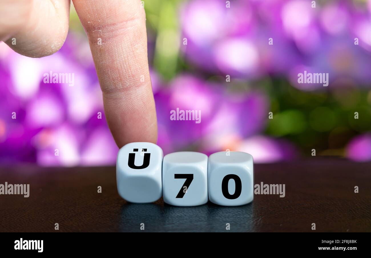 Dice form the German expression "UE 70" (above 70 years old) as symbol for people older than 70 years. Stock Photo