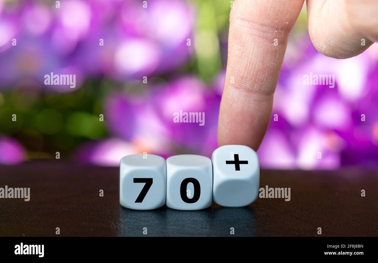 Dice form the expression 70+ as symbol for all people older than 70 years. Stock Photo