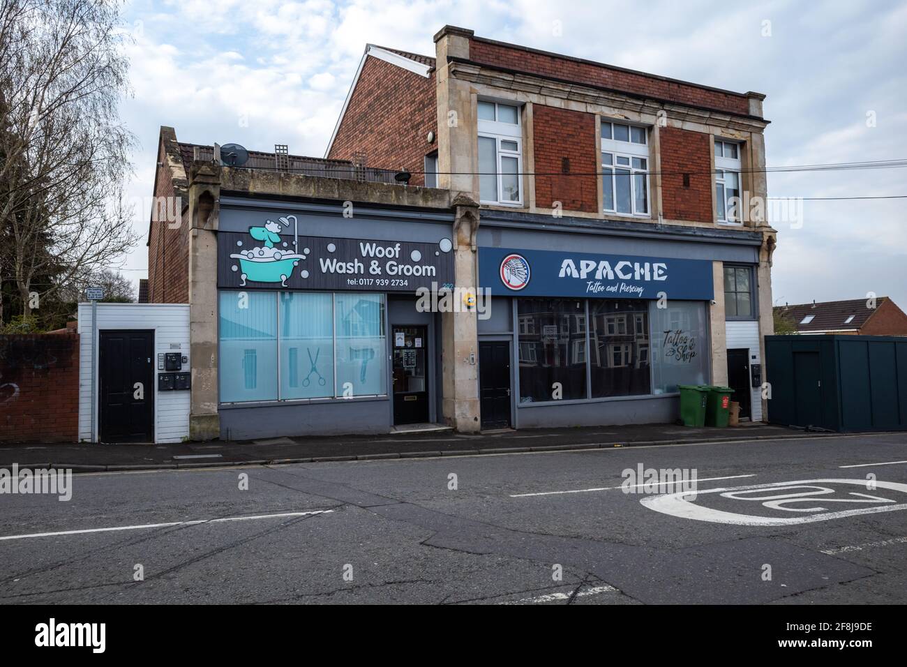 Woof Wash and Groom dog grooming salon and Apache Tattoo and Piercing studio (April 2021) Stock Photo