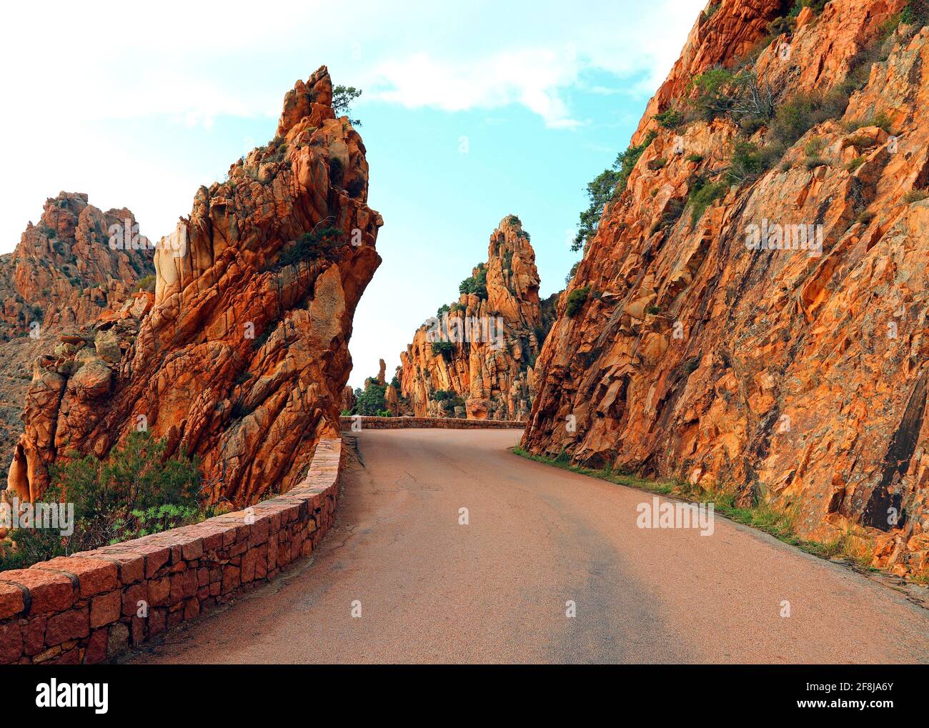 road called D81 in Corsica France and the red rocks called Calanches Stock Photo