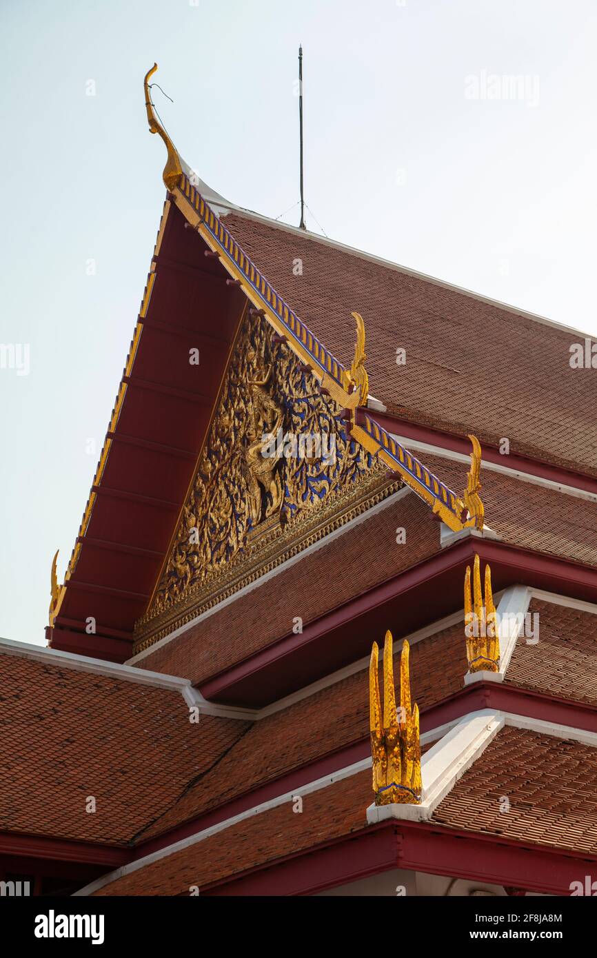 Bangkok, Thailand - March 25, 2018: Siwamokkhaphiman Hall, part of the Bangkok National Museum, with its characteristic red roofs and polychrome and g Stock Photo