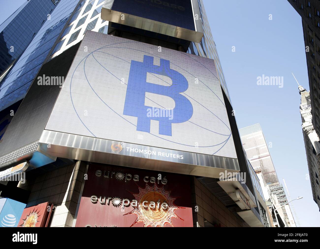 New York, United States. 14th Apr, 2021. The Bitcoin logo is displayed on a  screen in Times Square when Coinbase Global, Inc. beings trading under the  symbol COIN at the Nasdaq Opening